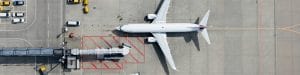 white plane aerial view at gate