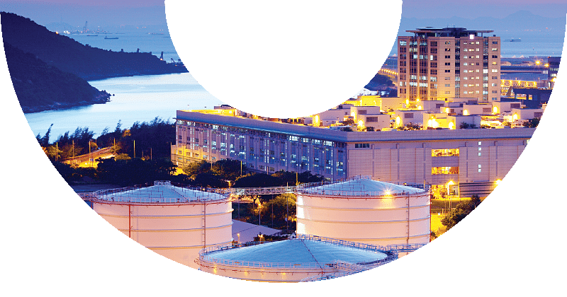 storage tanks in harbor at dusk