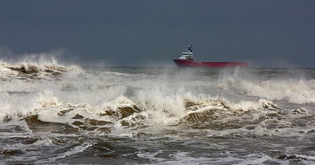 red tanker in rough seas