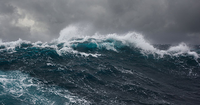 dark blue stormy seas and gray skies