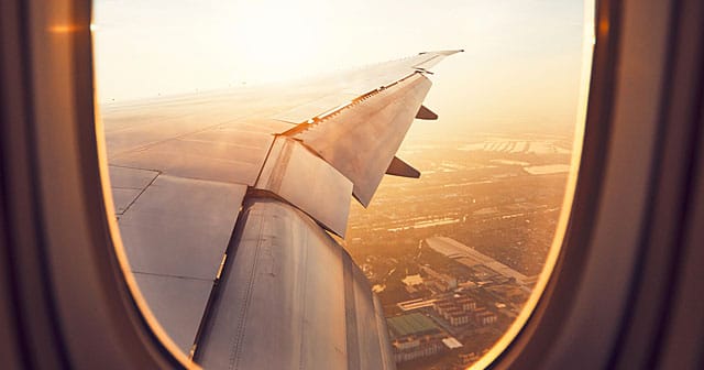 news insights sunny view of airplane wing out window