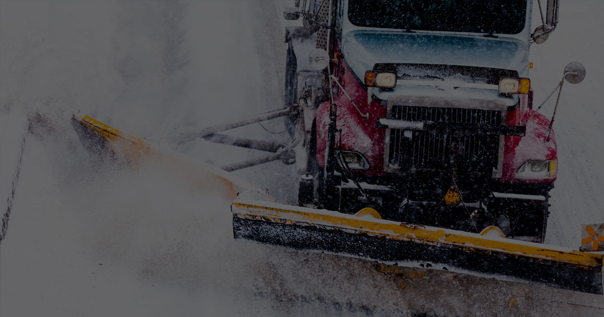 red snowplow driving high pov