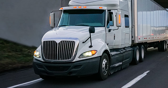 news insight white semi tractor driving on freeway