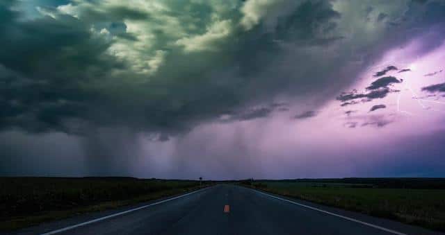 Thunderstorm clouds over highway