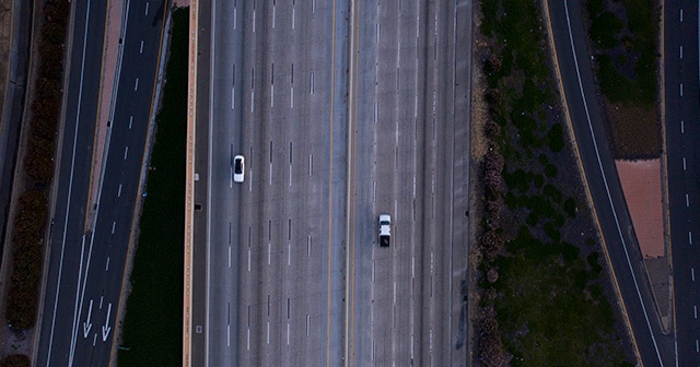 two cars on empty highway