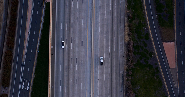 two cars on empty highway