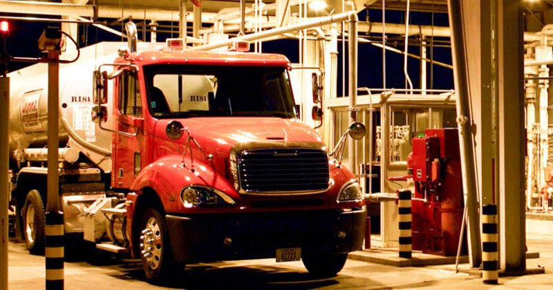 red fuel truck at rack