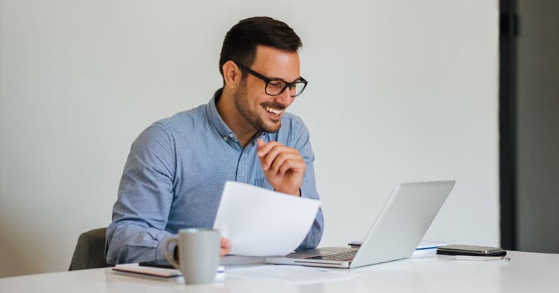 happy businessman at computer