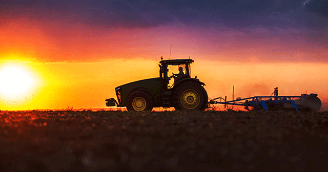 Tractor silhouette at sunrise