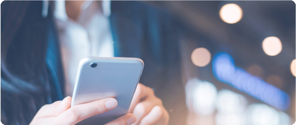 Businesswoman looking at smartphone
