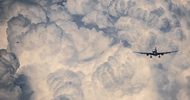 Blog Header Two Planes flying in clouded sky