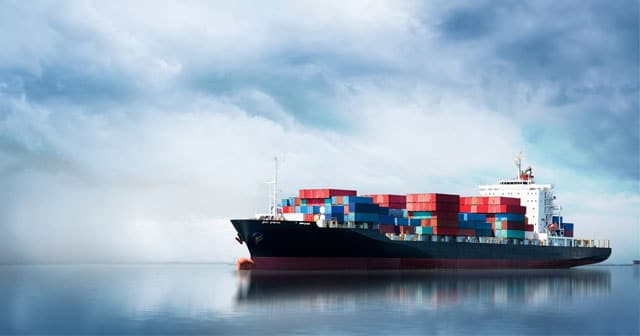 Cargo ship surrounded by clouds