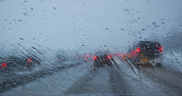 Blog header rainy car windshield