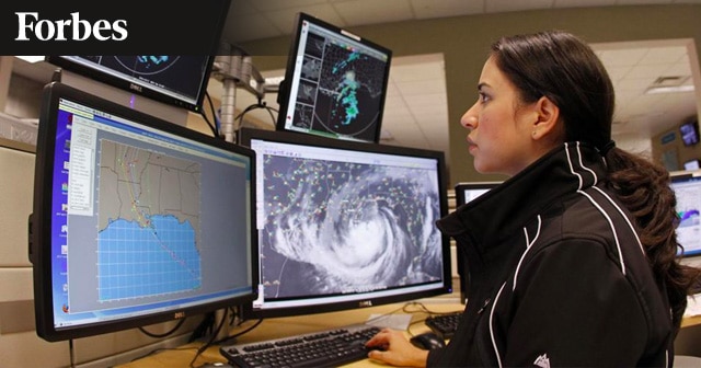 News Insights Woman monitoring weather on computer screens