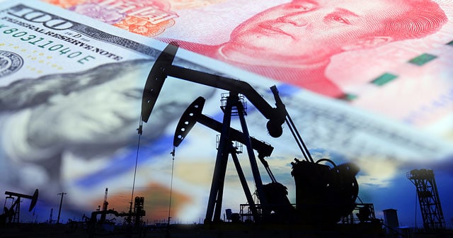 oil rig silhouette with u.s. and chinese currency background