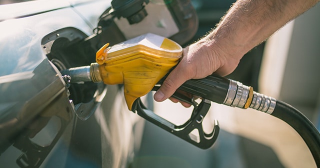 Blog Header Hand on Gas Pump