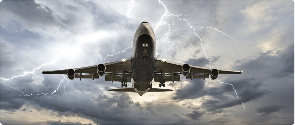 Airplane flying with lighting in sky