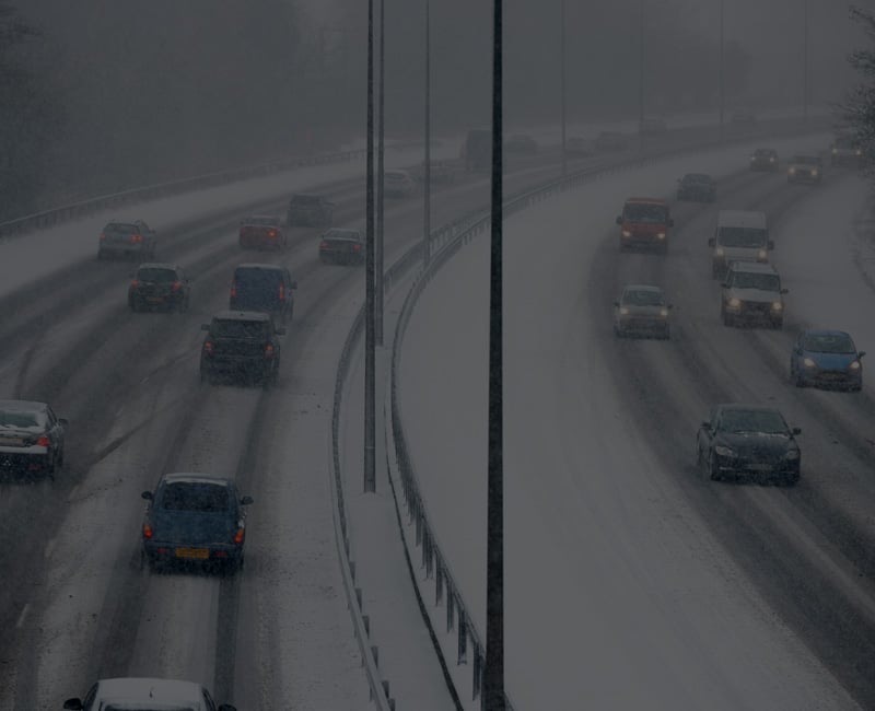 Cars on snowy UK highway