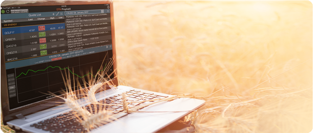 Laptop with trading screen in wheat field
