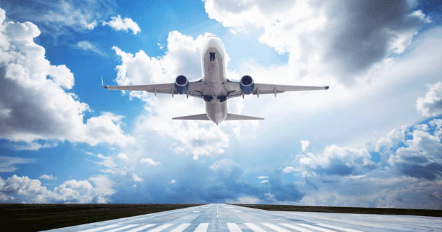 Blog Header Airplane taking over with blue sky above