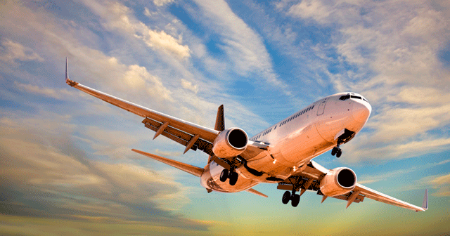 Blog Header Airplane flying in the sky