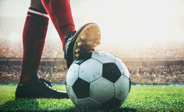 Foot on soccer ball