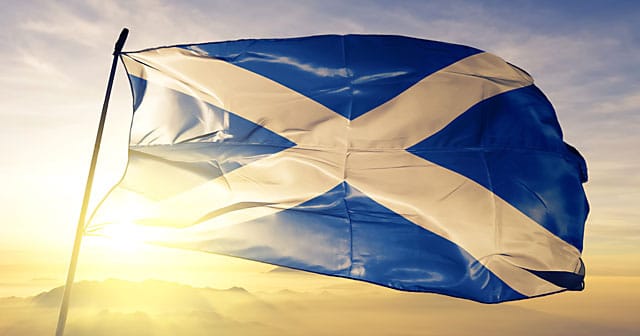 news insights scottish flag waving over sunrise