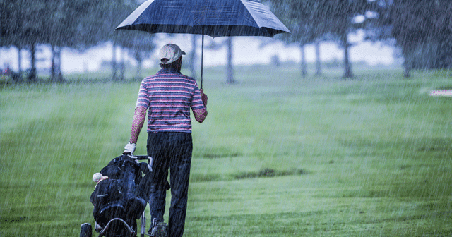 News Insights Golfer in the rain