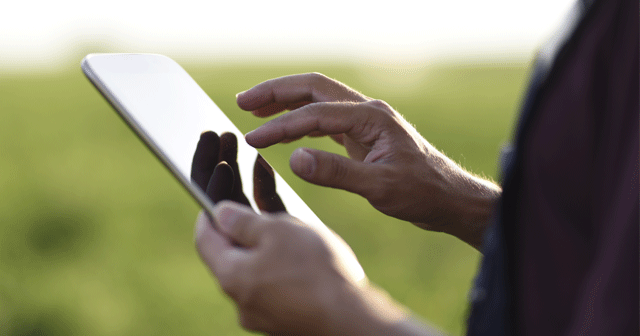 Blog header Farmer using tablet