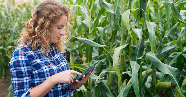 Blog Header Young Woman Farmer with Tablet