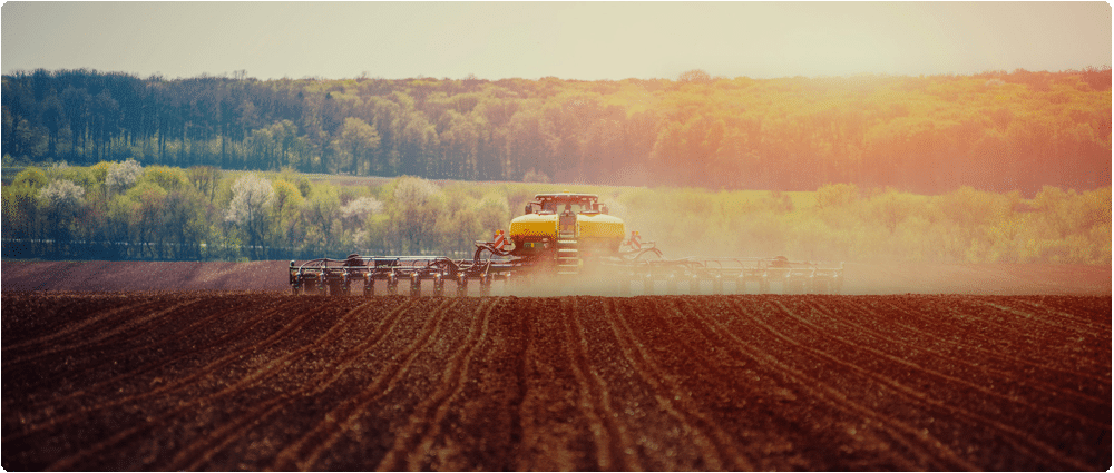 Tractor plowing farm field