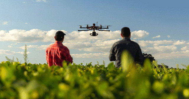 Blog header Two farmers flying drone
