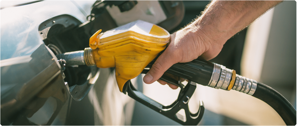 Closeup of hand pumping gas