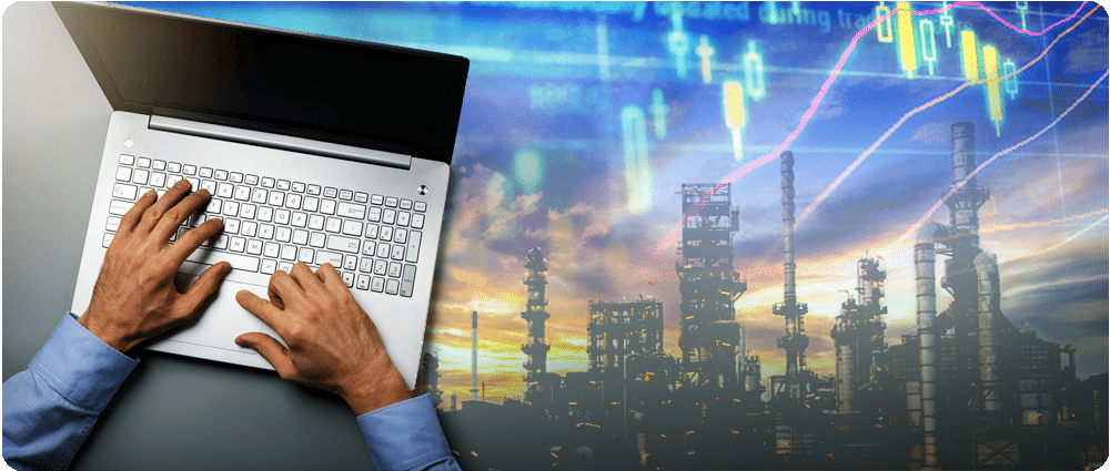 Hands on computer with data over refinery