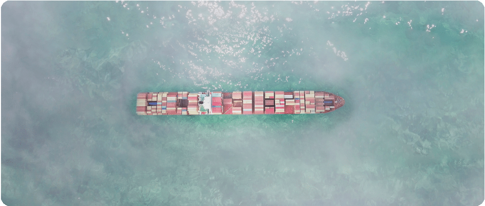 Aerial view of cargo ship in foggy weather