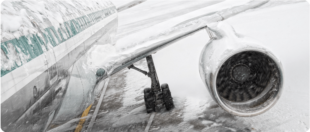 Airplane covered in snow and ice
