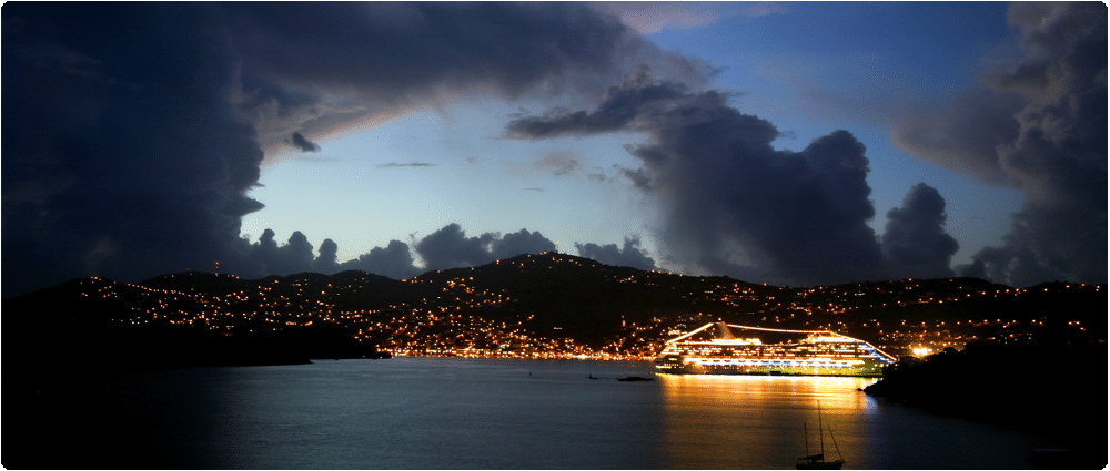 Cruise ship with storm clouds forming