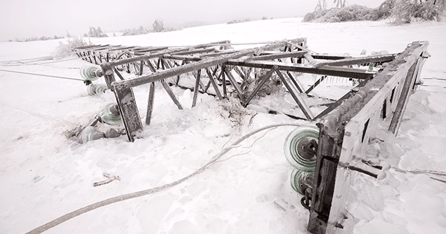 Blog header fallen power pole covered in ice