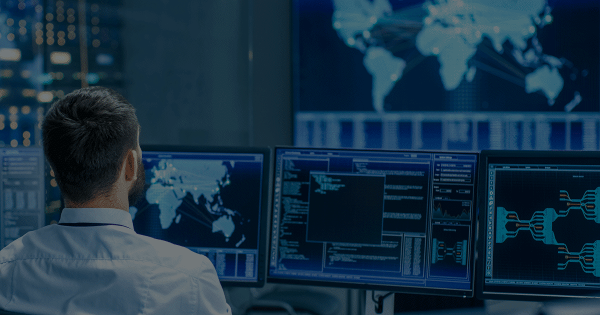 Features Man in control room with maps