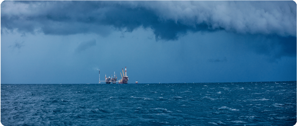 Oil Rig in distance surrounded by storm