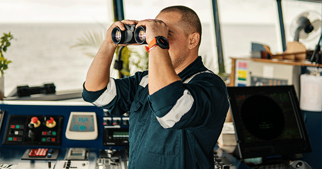 Blog header navigation officer looking through binoculars