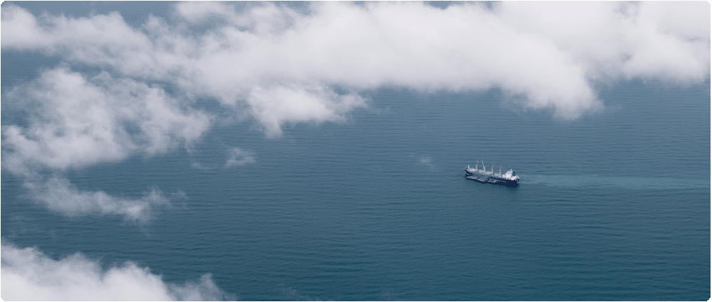 Container ship surrounded by clouds