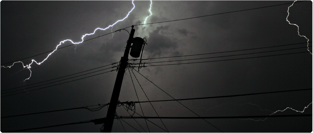 Transformer silhouette with lightning strike