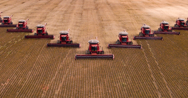 Blog header Tractors harvesting in a row