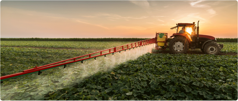 Tractor spraying pesticides