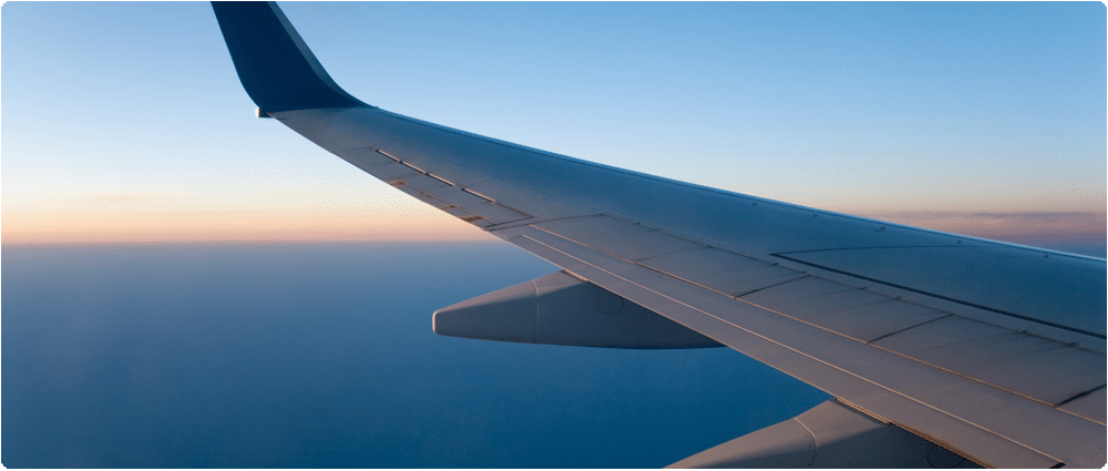 Airplane wing in sky