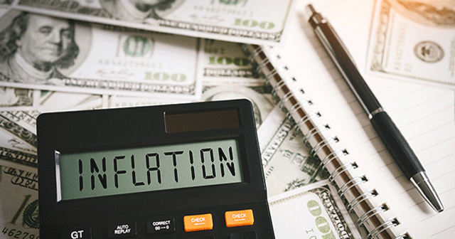 Blog header money, calculator with inflation on screen