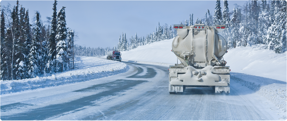 Fuel trucks passing on winter road