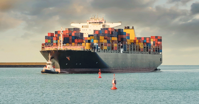 Blog header Large Cargo ship with tugboat