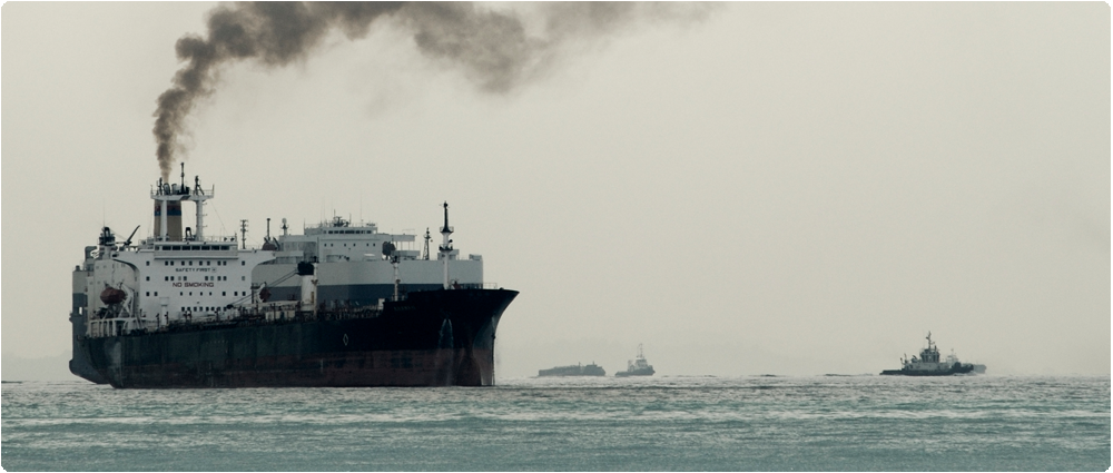 Large ship with black exhaust